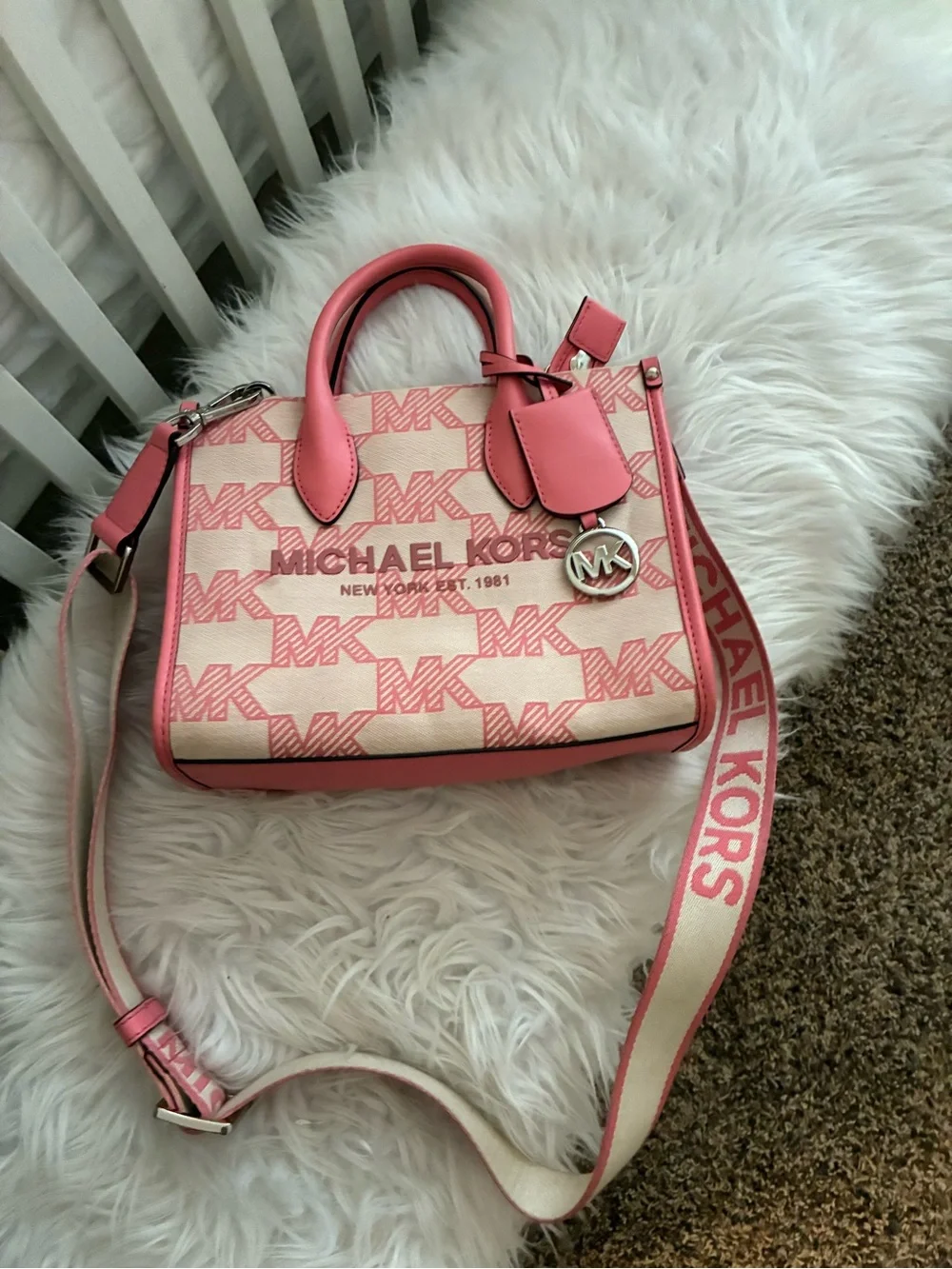Michael Kors Mirella Small Logo Jacquard Crossbody Bag tea rose pink colorway.